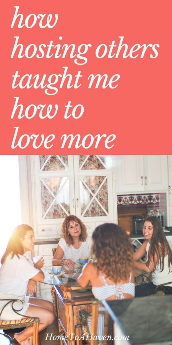 Four women sit around a table and visit