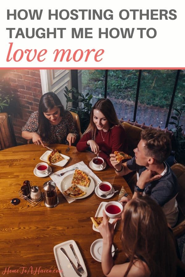 Group of friends sit around the table and eat