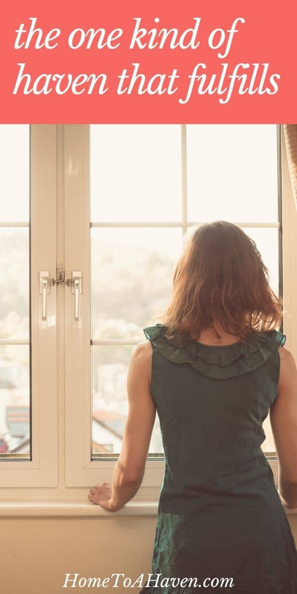 Woman looks out window